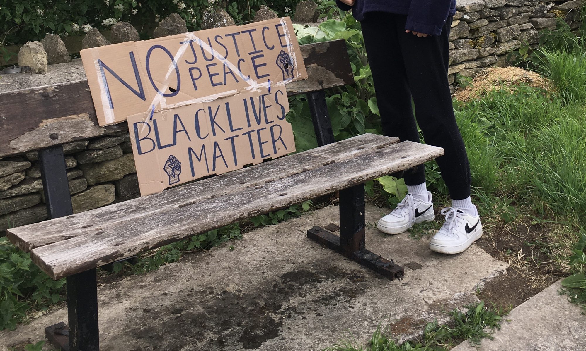 BLM sign on village bench